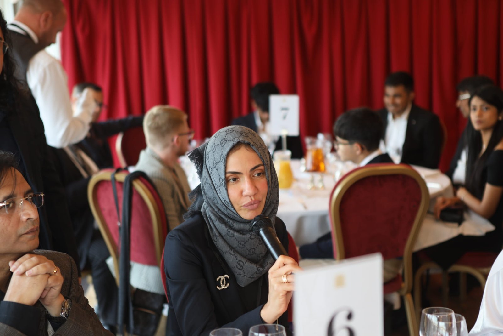 A delegate listens during the round-table session at the Westminster conclave