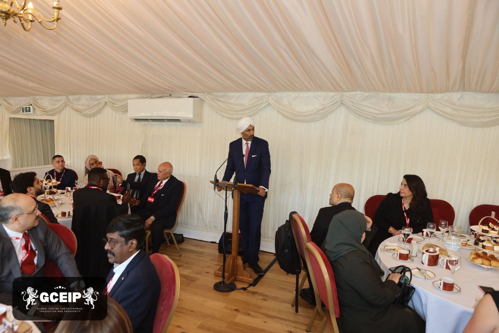 A speaker addresses guests at the House of Lords during the Global Business Conclave 2026