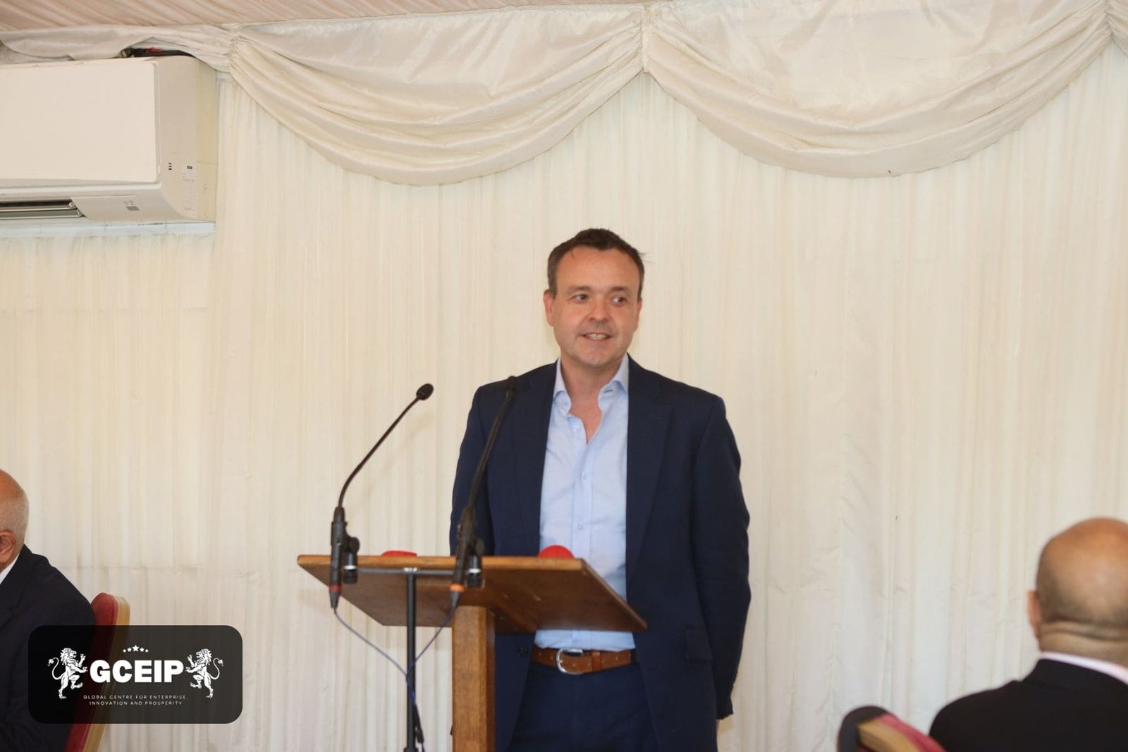 A speaker addresses delegates at the House of Lords during the Global Business Conclave 2026