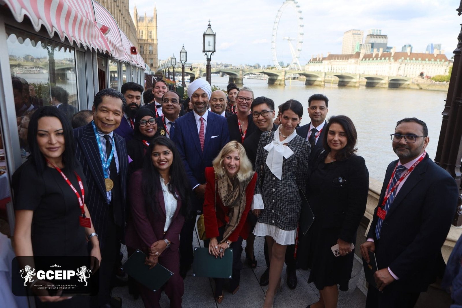 Honourees and guests gather on the House of Lords terrace beside the River Thames, London